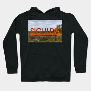 Big orange inscription Sigulda on wooden balustrade Hoodie